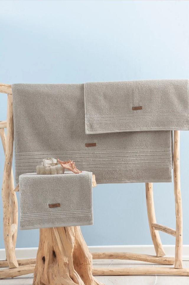 Asciugamano beige di sabbia per benessere di cotone in cotone