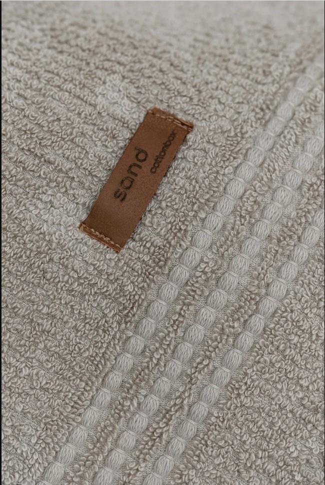 Asciugamano beige di sabbia per benessere di cotone in cotone